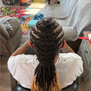 Black and Brown Cornrow Braids with Low Ponytail